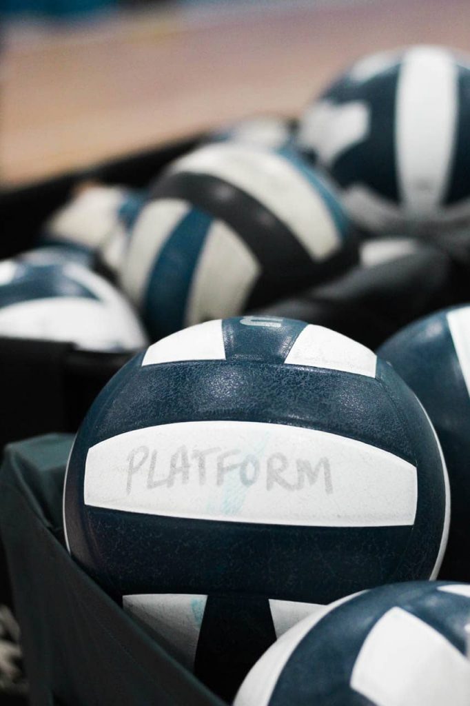 Pile of volleyballs.