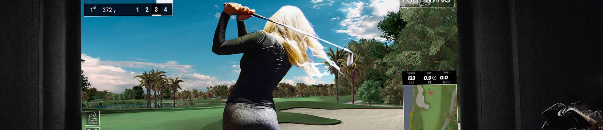 woman using golf simulator